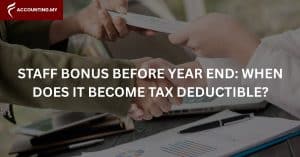 Home 9 Photo of a person giving another money, representing bonus tax deductible Malaysia